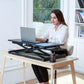 sit at work with a sit stand desk converter